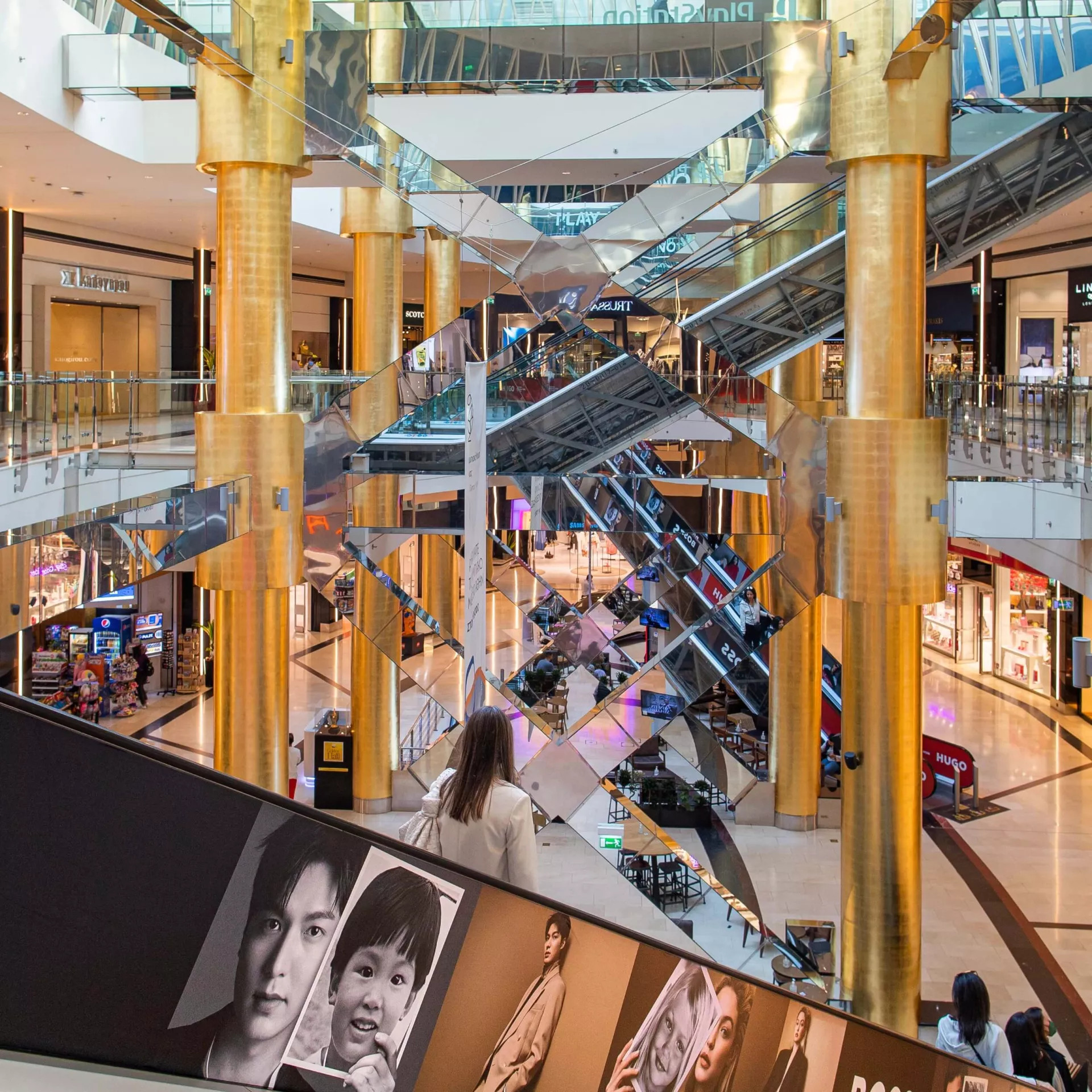Golden Hall The interior of the Golden Hall mall, featuring luxury stores, escalators and visitors.