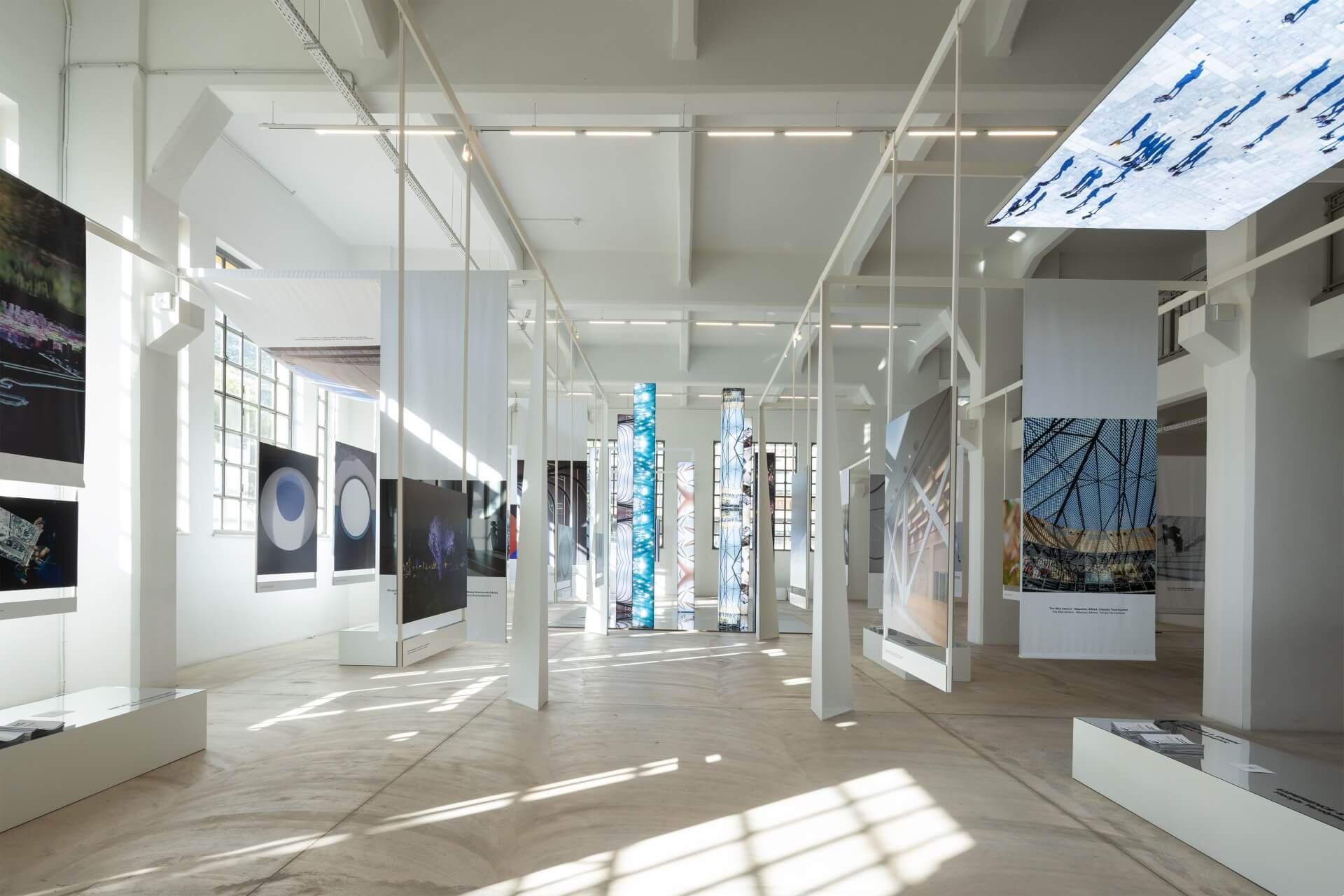 Landmarks of Connection” Exhibition The exhibition venue. Large photographs on panels and illuminated columns.